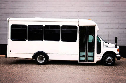 inside luxury limo bus with colorful lighting